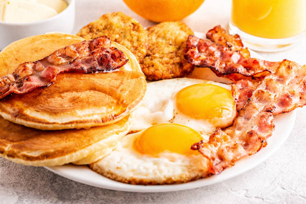 istock Healthy Full American Breakfast with Eggs Bacon Pancakes and Latkes 1133418676