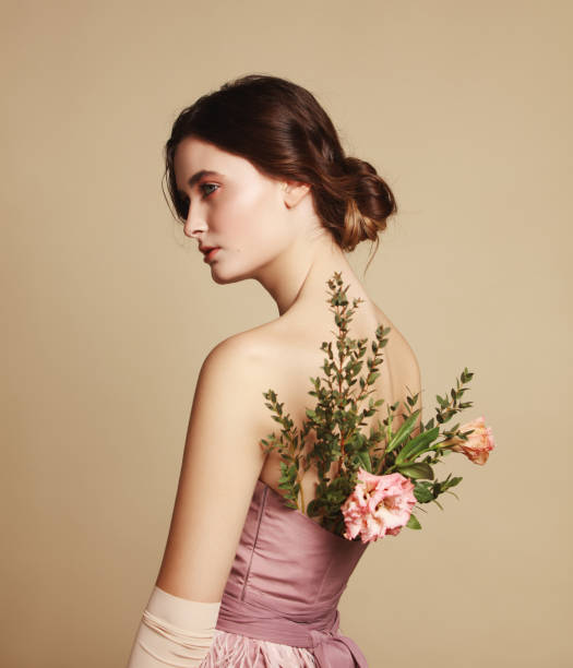 istock Young beautiful girl and flowers 1133422937