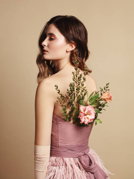 istock Young beautiful girl and flowers 1133422948