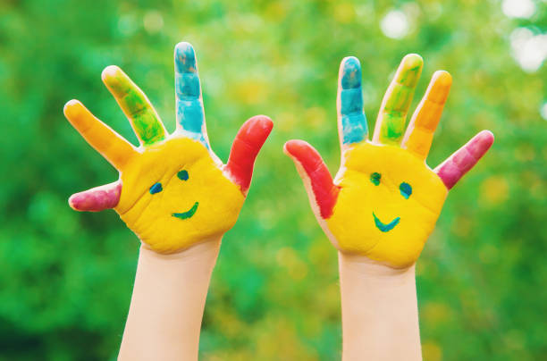 istock children hands in colors. Summer photo. Selective focus. 1133423221