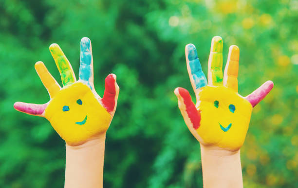 istock children hands in colors. Summer photo. Selective focus. 1133423222