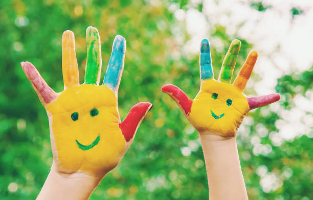istock children hands in colors. Summer photo. Selective focus. 1133423228