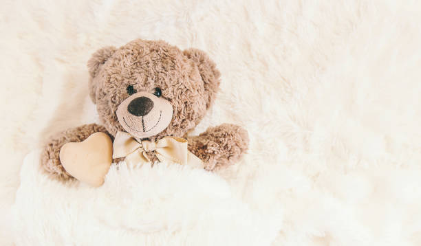 istock children's toy sleeps under the blanket. copy space. Selective focus. 1133423243