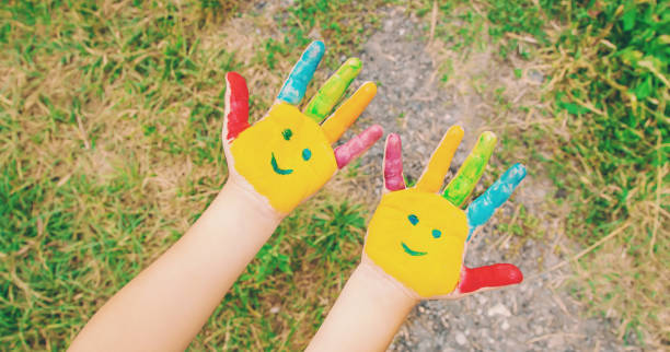 istock children hands in colors. Summer photo. Selective focus. 1133423245