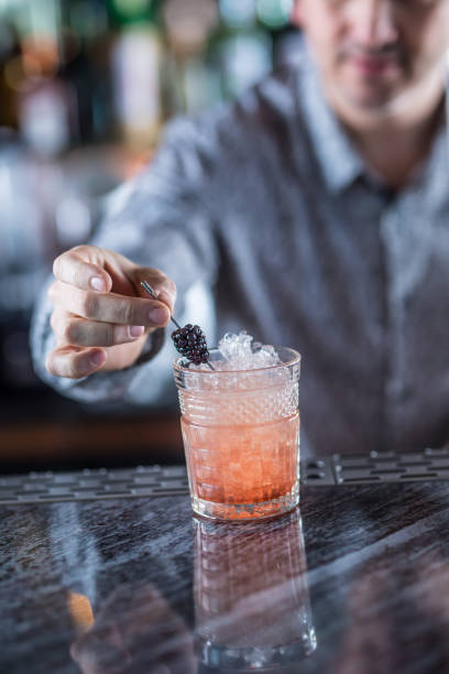 istock Professional barman making alcoholic cocktail drink. 1133426133