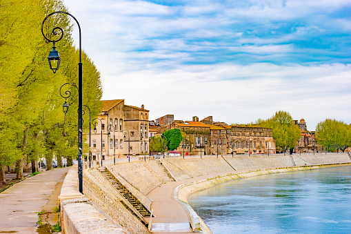 The river Rhone at Arles overlooking the old town. Buches du Rhone, Provence, France.