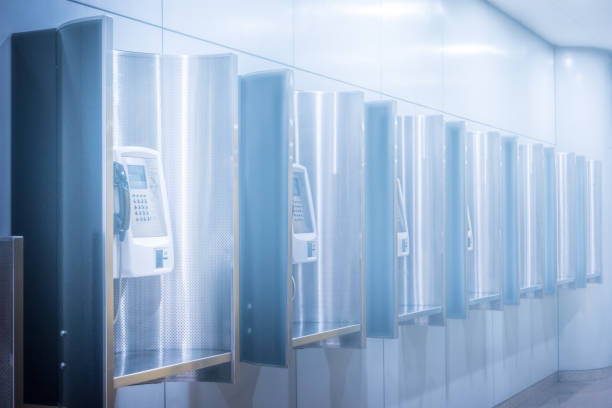 istock Perspective row of public telephone inside modern building 1133428173