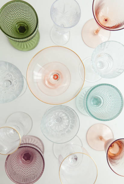 set of multi-colored glasses for different drinks. top view. pink, blue, white, green, golden. - champagne pink luxury table imagens e fotografias de stock