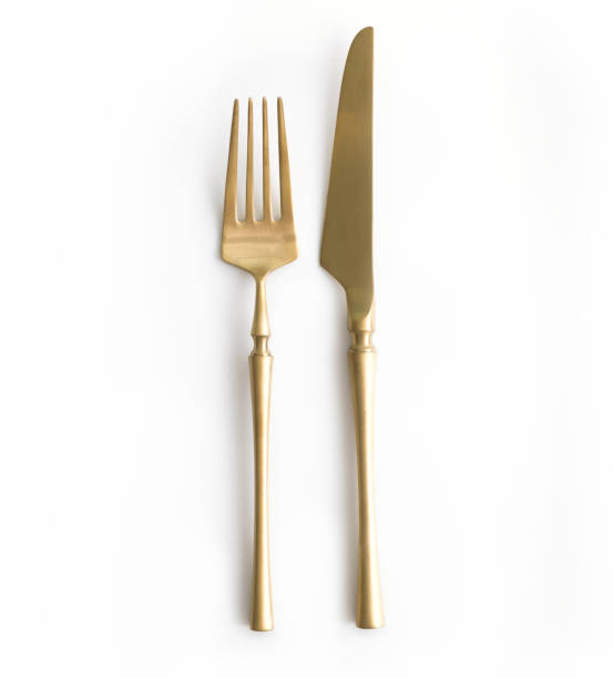 golden cutlery view from above on a white background. top view.
knife and fork for a festive table for a wedding, birthday or party. - fork silverware table knife silver imagens e fotografias de stock