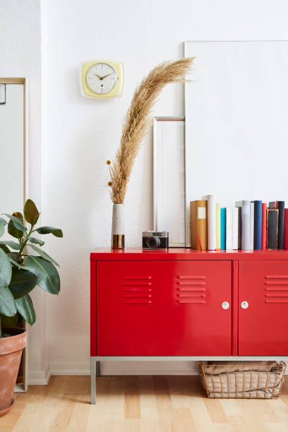 istock modern decoraion books picture frames on red metal cabinet 1133431174