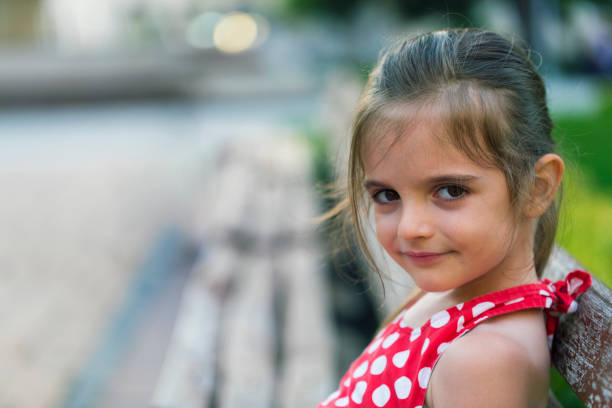Beautiful little girl in summer day.