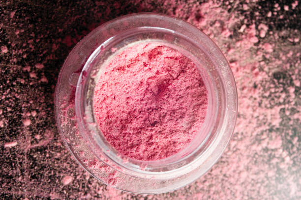 Gulal (Colored Powder) in bowl on white background. Holi is a popular and significant Hindu festival celebrated as the Festival of Colours, Love and Spring. It celebrates the eternal and divine love of the god Radha and Krishna.