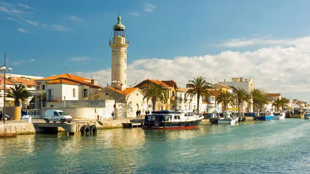 Canal and lighthouse in Grau du Roi, Camargue, France