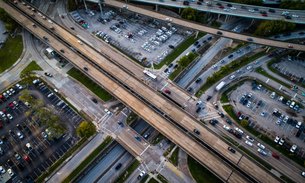 istock Looking down from above highways and parking lots transportation infrastructure 1133435832