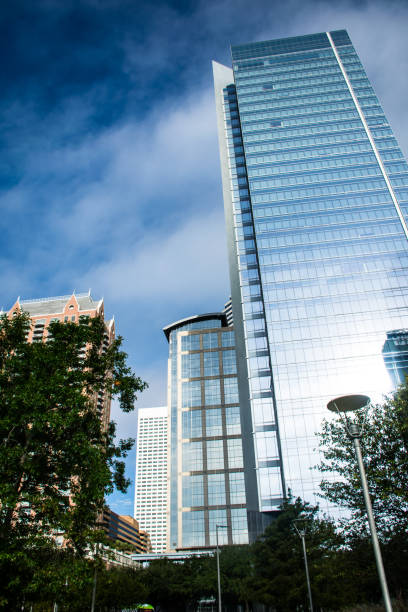 istock Silver Skyscraper rises up in a Modern Futuristic Design in Houston , Texas 1133436064