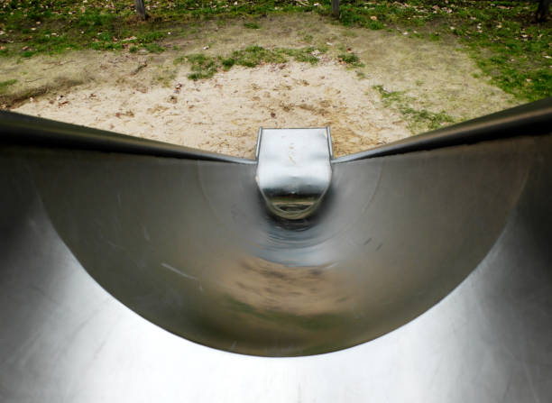 Metal slide on the children's playground, to-down view. stock photo