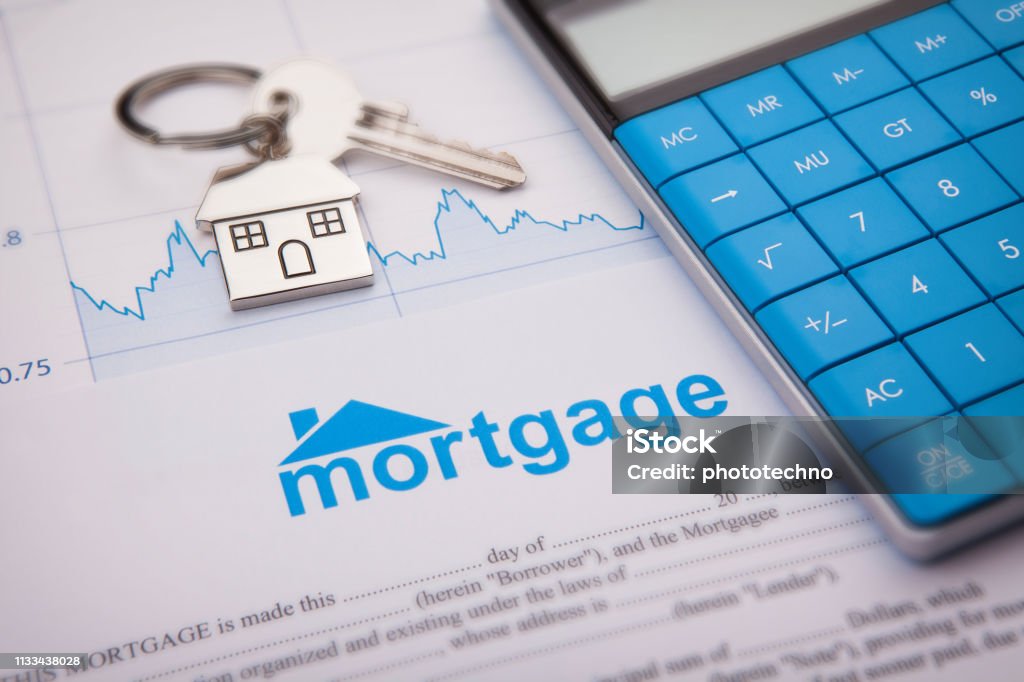 An empty mortgage application form with house key Mortgage Loan Stock Photo