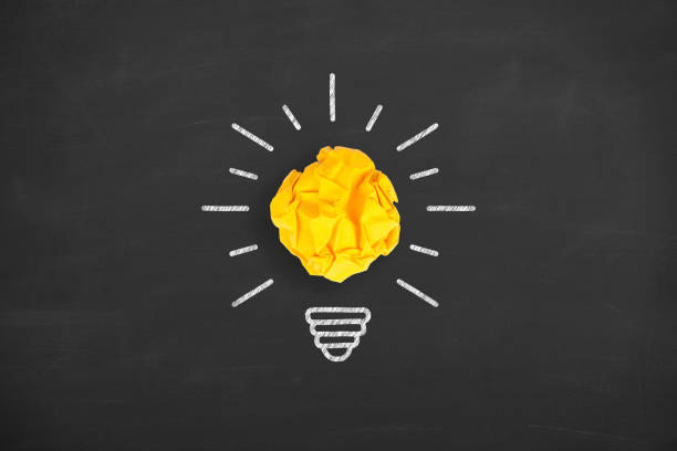 istock Idea Concepts Light Bulb Crumpled Paper on Blackboard 1133438510