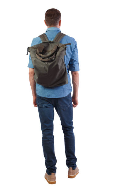 istock Back view of a man with a green bag. 1133438637
