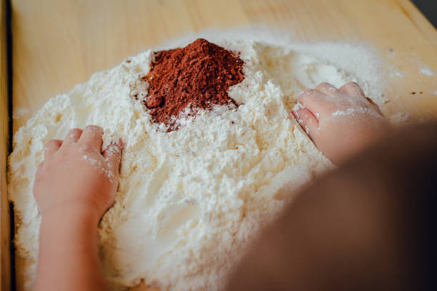 Help children during baking and cooking. The child helps to prepare the dough for baking.