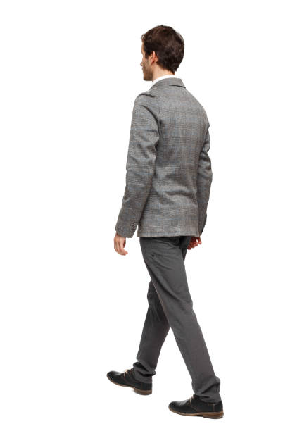 istock back view of walking business man. 1133439542