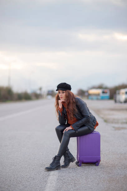 traveler woman waiting for bus