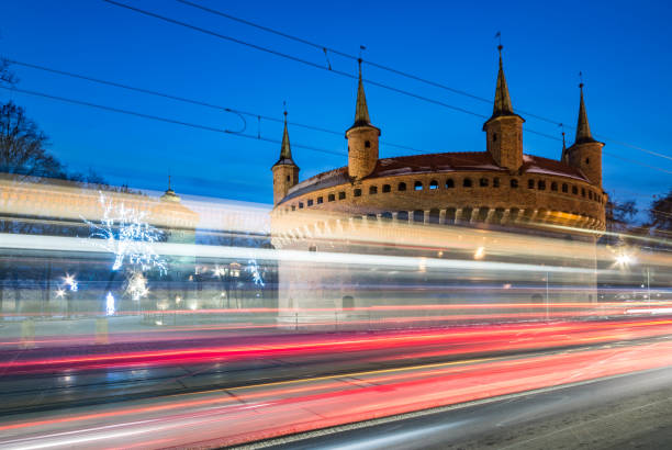 istock Krakow, Poland, gothic barbican in the night and traffic light trails 1133439749
