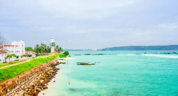 Photo of View on white mosque, Lighthouse And Palm Trees In The Town Of Galle, Sri Lanka