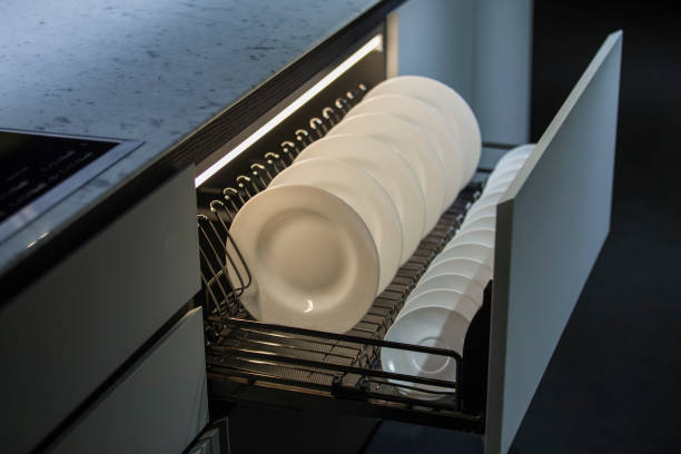 istock Modern kitchen, storage space for plates, illuminated drawer in luxury kitchen 1133440938