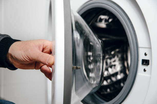 istock Opening the door from the washing machine. 1133441592