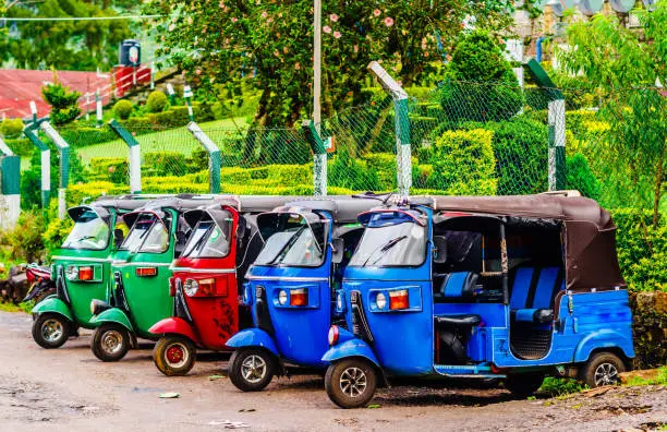 Photo of View on colorful Tuk tuk taxis parking on street in Haputale, Sri Lanka