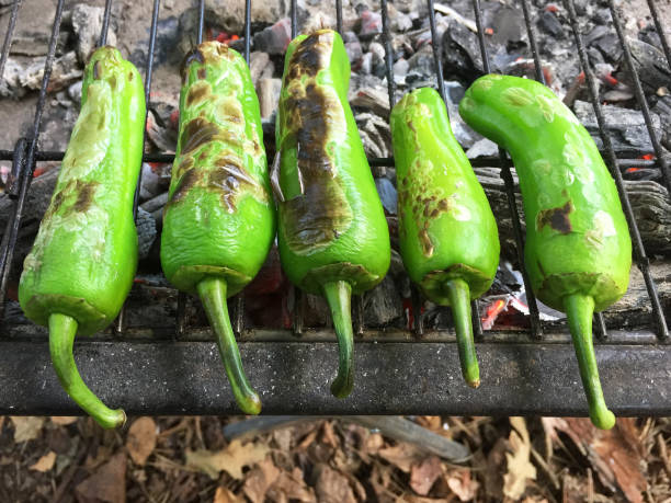 istock Green chili peppers on barbecue grill 1133441793