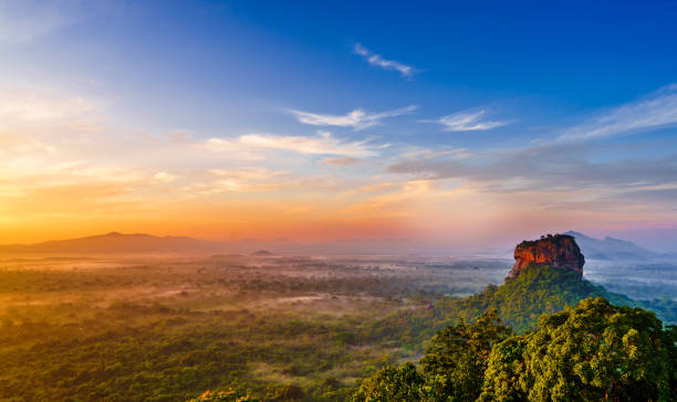Sunrise view to Sigiriya rock - Lion Rock - from Pidurangala Rock in Sri Lanka stock photo