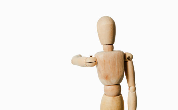 istock A wooden mannequin shows with his hand. 1133441918