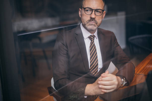 istock Serious senior man in a suit 1133443181