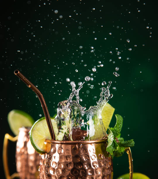 istock Famous splashing Moscow mule alcoholic cocktail in copper mugs. 1133444299