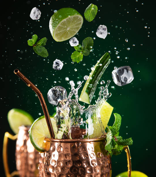 istock Famous splashing Moscow mule alcoholic cocktail in copper mugs. 1133444309