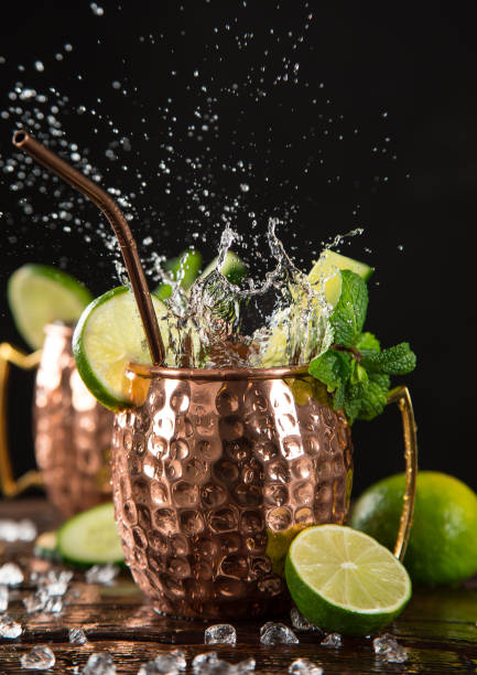 istock Famous splashing Moscow mule alcoholic cocktail in copper mugs. 1133444332