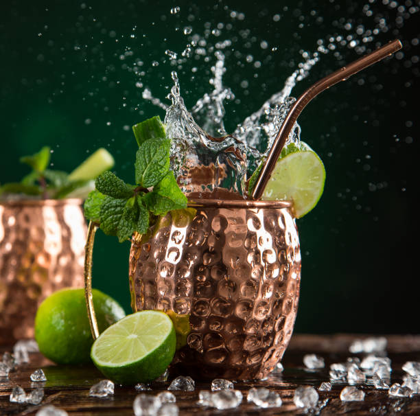 istock Famous splashing Moscow mule alcoholic cocktail in copper mugs. 1133444350