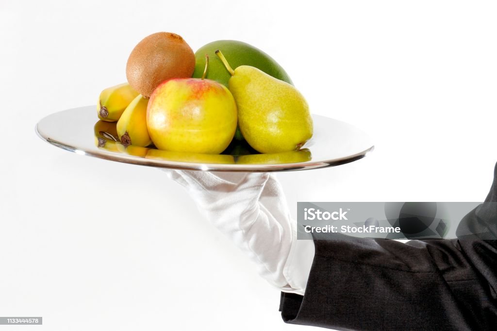 Bringing fruit present Waiter brings and presents fresh fruit Apple - Fruit Stock Photo