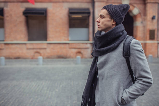 istock Stylish guy walking on the street 1133445250
