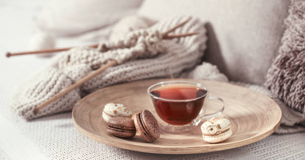 istock vintage knitting needles and yarn with a Cup of tea 1133449793