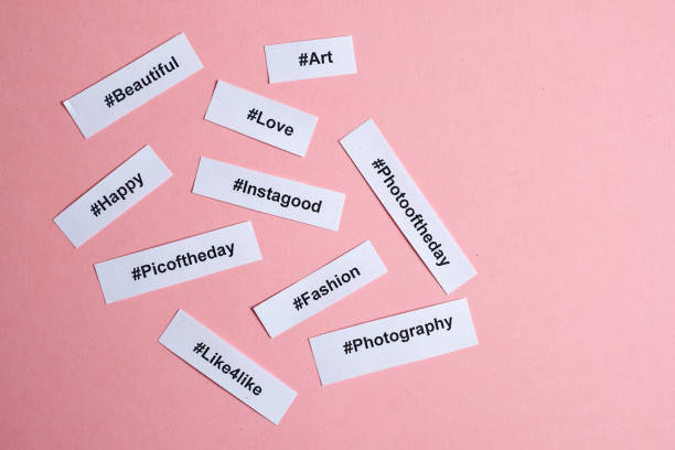 istock Popular hashtags printed on white paper on a pink background. 1133450175