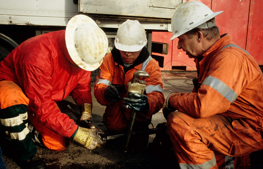Rig-personnel in the salt-mining industry occupied with wire line tools in Sexbierum, Friesland, the Netherlands on Sept 8, 2008