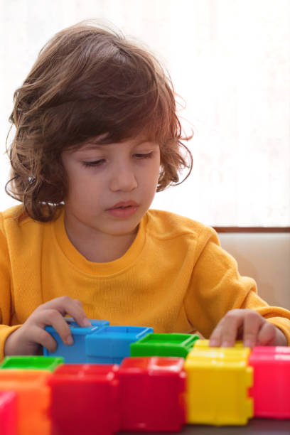 istock Happy child playing with Preschoolers Building Blocks 1133451010