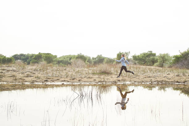 istock Woman Running Outdoors 1133463278
