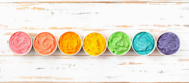 istock Many cups with colorful rainbow ice cream. Top view 1133464963