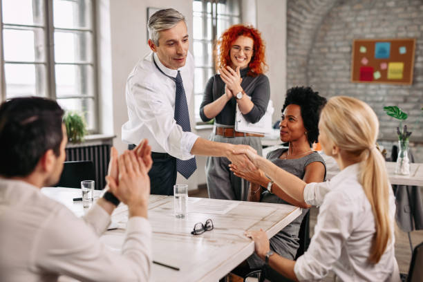 istock Happy business people shaking hands after successful meeting. 1133466401