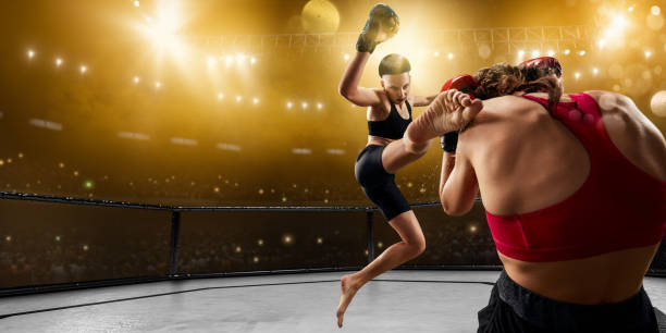 istock Female MMA fighters in professional boxing ring 1133468121