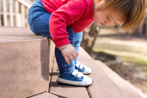 istock Happy toddler boy tying his sneakers 1133468461